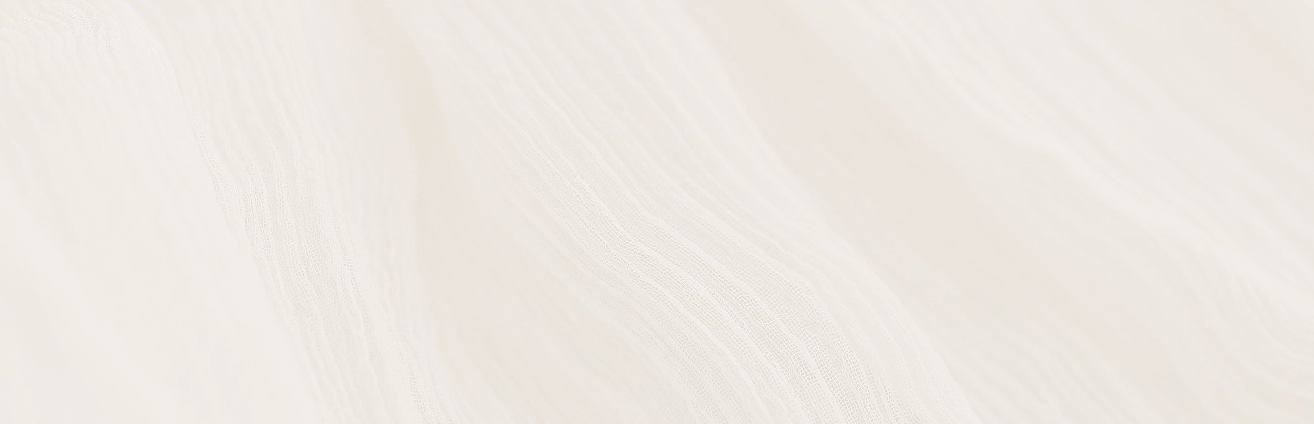 Close-up of white textured fabric.