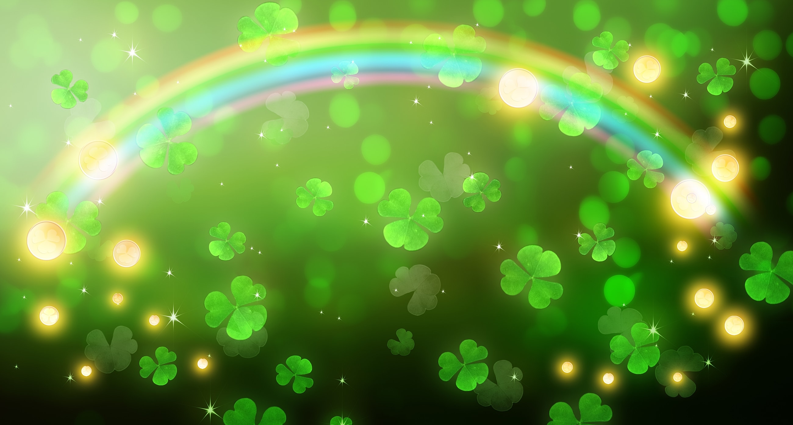 Colorful shamrocks and rainbow on green background.
