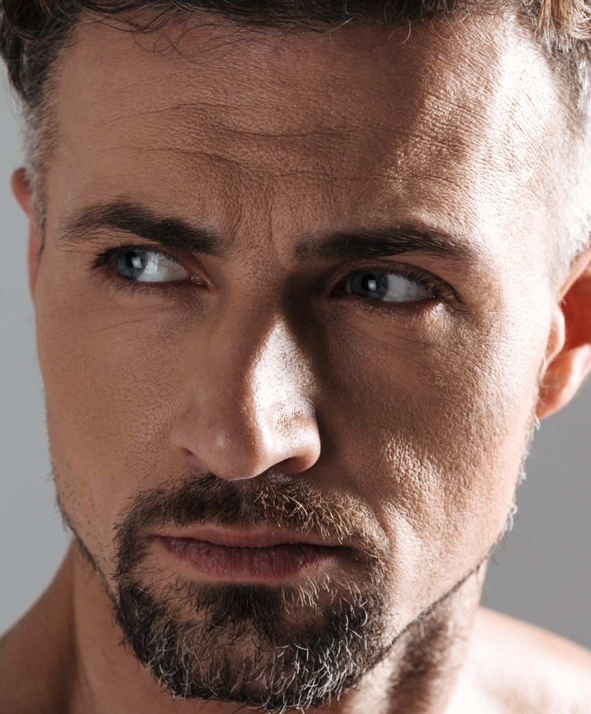 charlotte blepharoplasty for men model with blue eyes
