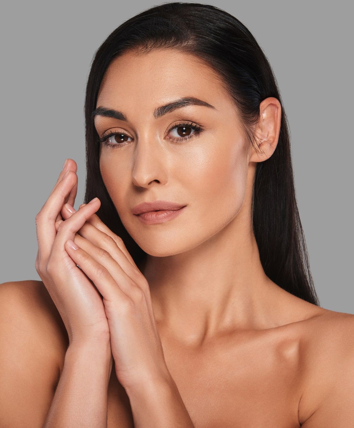 Portrait of a woman with graceful hands.