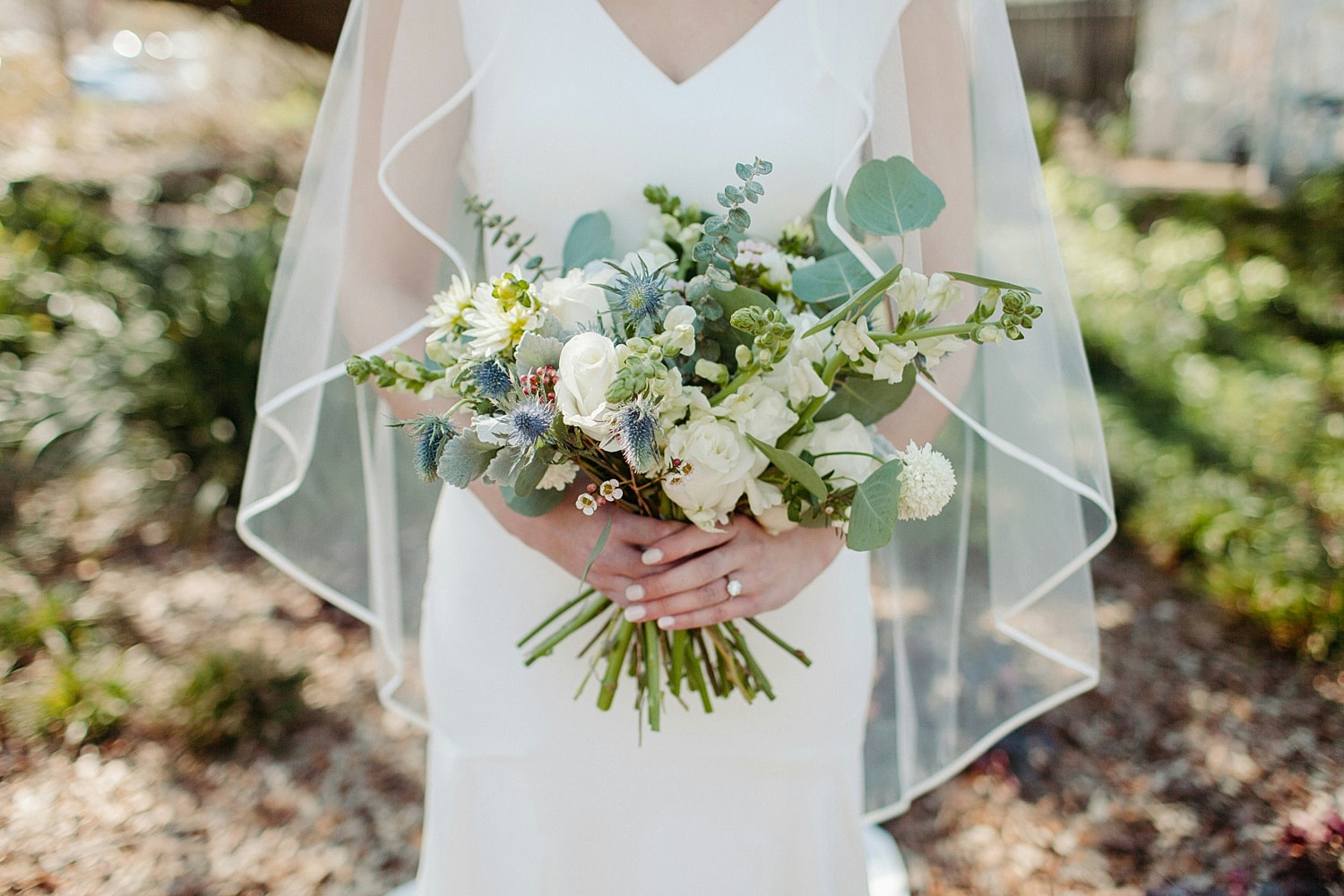 Bride holding a beautiful bouquet of flowers.