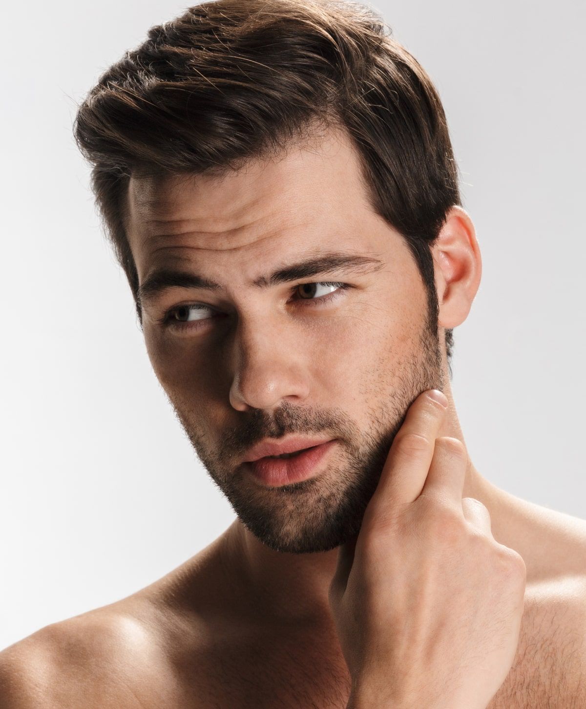 Model in white lingerie against a neutral background.